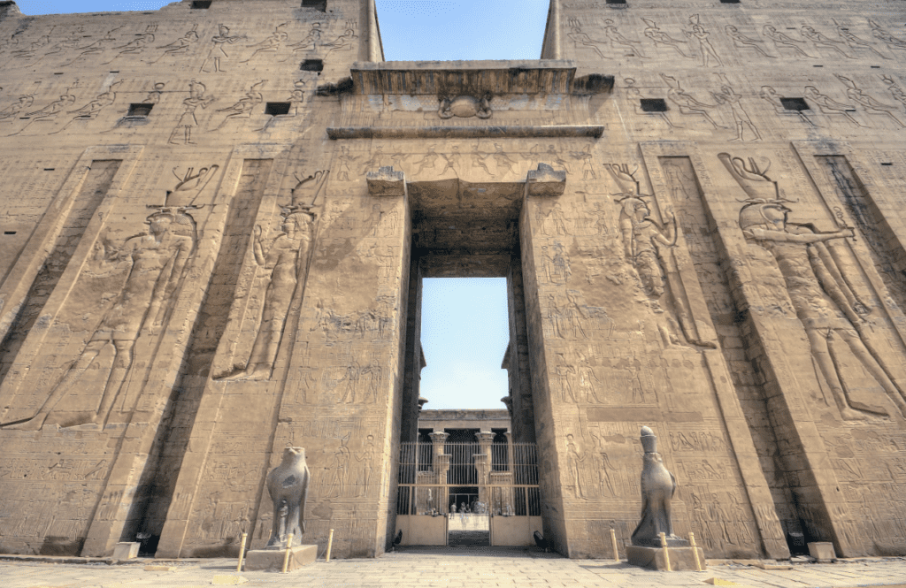 Entrance to Edfu Temple with the God Horus standing guard on both sides