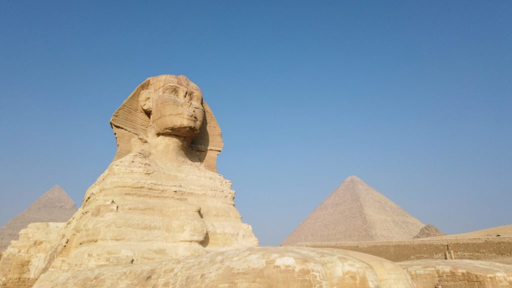 Sphinx with Pyramid in background, Cairo Egypt