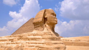 Great Sphinx in the foreground with Great Pyramid behind it. Amazing semi cloudy ski